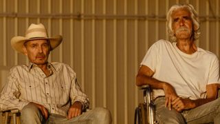 Tommy and TJ sit and watch the sunset