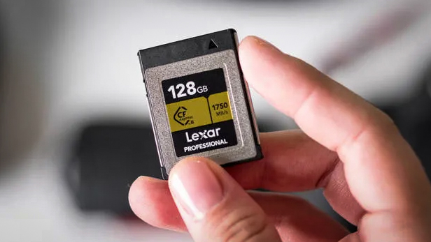 Lexar Gold Series Professional 256GB CFexpress  Type-B memory card being held in-hand