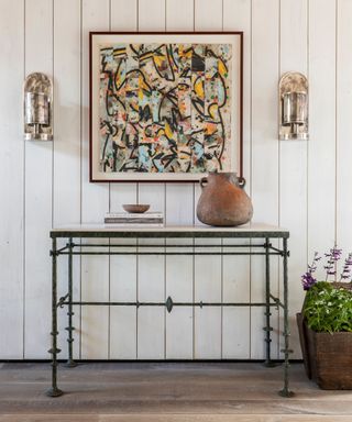 Entryway with console table and artwork above