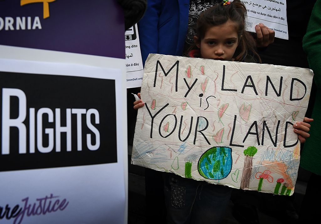 A child protesting with a migrant rights group.