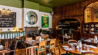 The restaurant's impressive stained glass and open kitchen