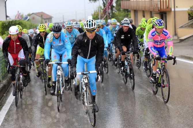 A soaked Giro d'Italia peloton en route from Longarone to Treviso during stage 12
