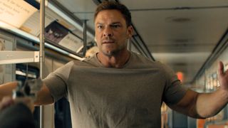 Jack has a gun pointed at him on a subway carriage