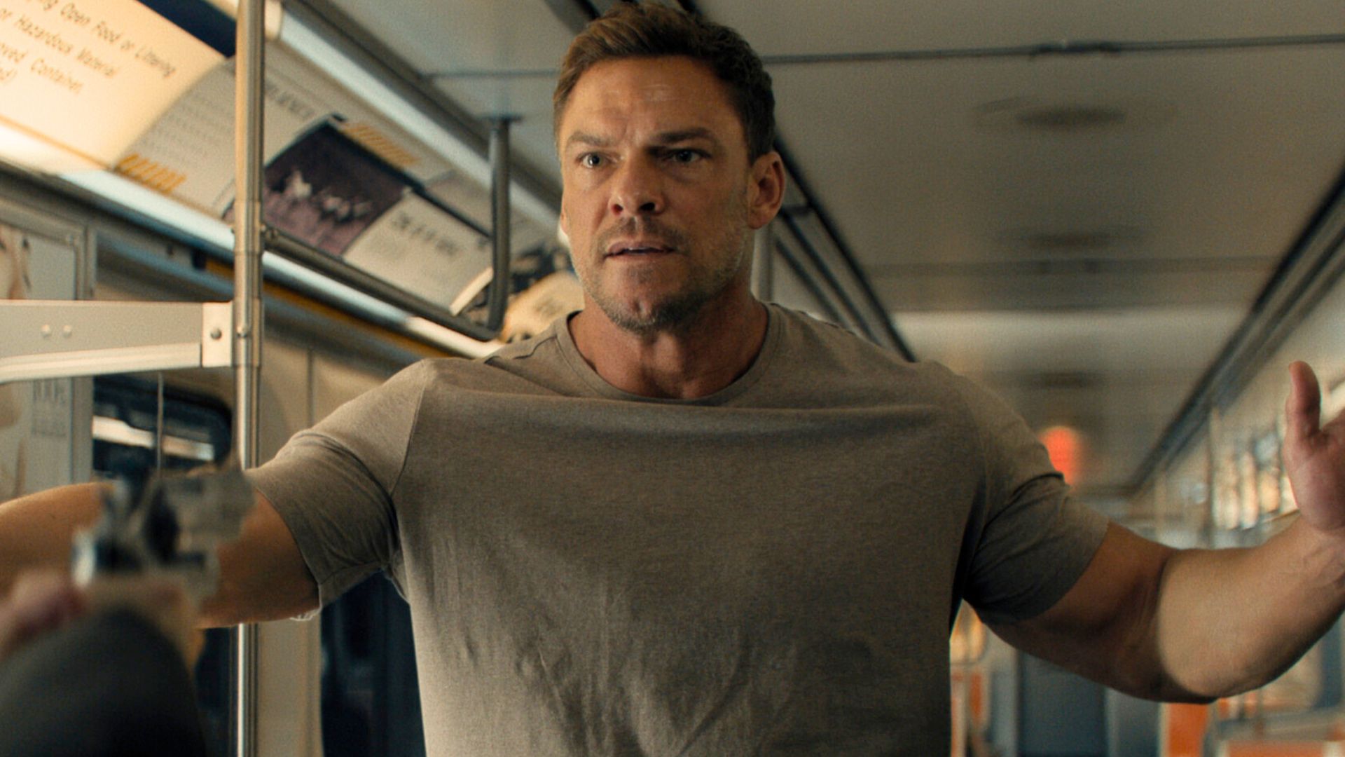 Jack has a gun pointed at him on a subway carriage