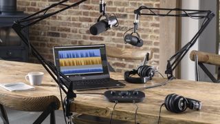 Lifestyle images of Vocaster hardware being used in a studio for podcasting