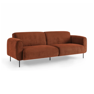 A rust colored sofa
