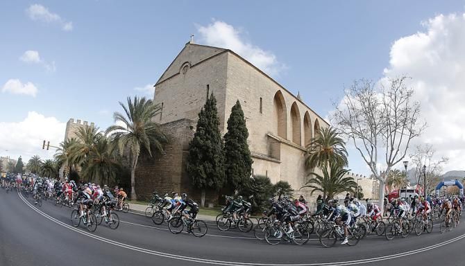The peloton heads through town in Mallorca