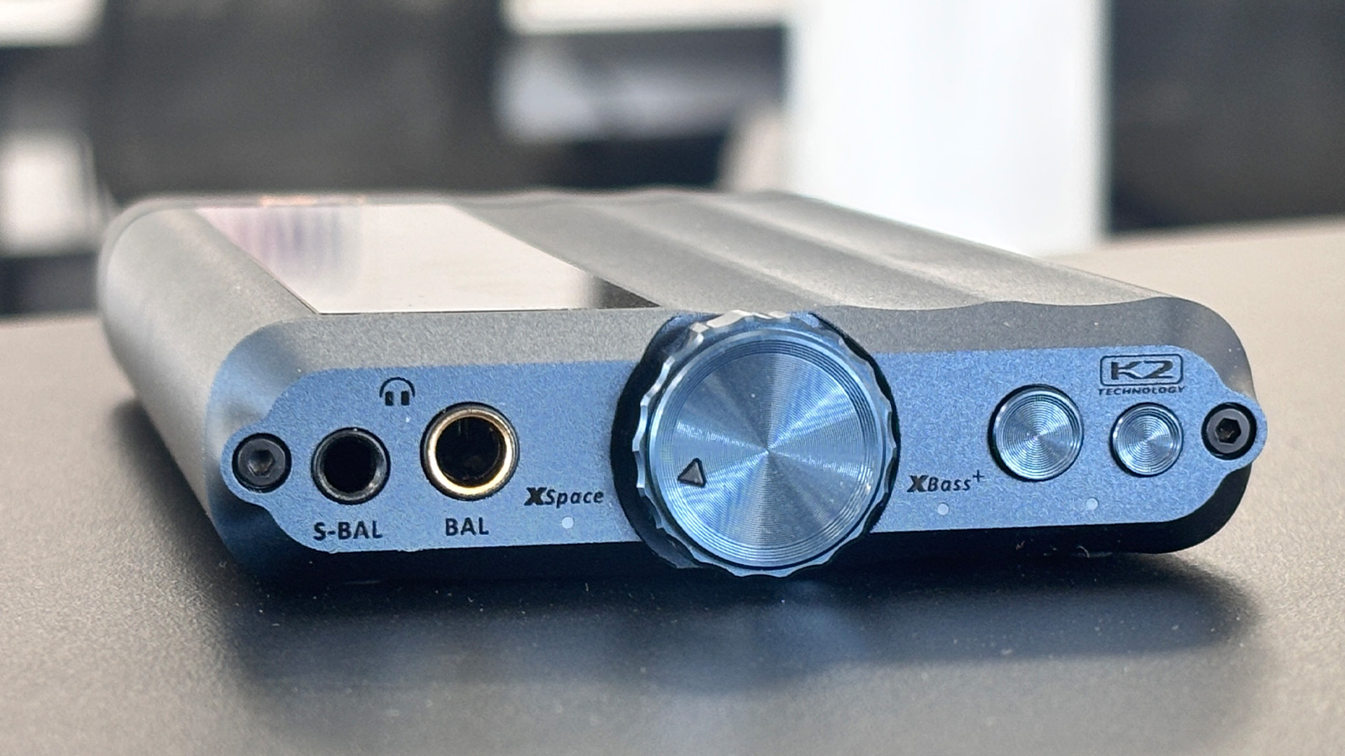 iFi iDSD GR 2 DAC on grey desk showing front panel