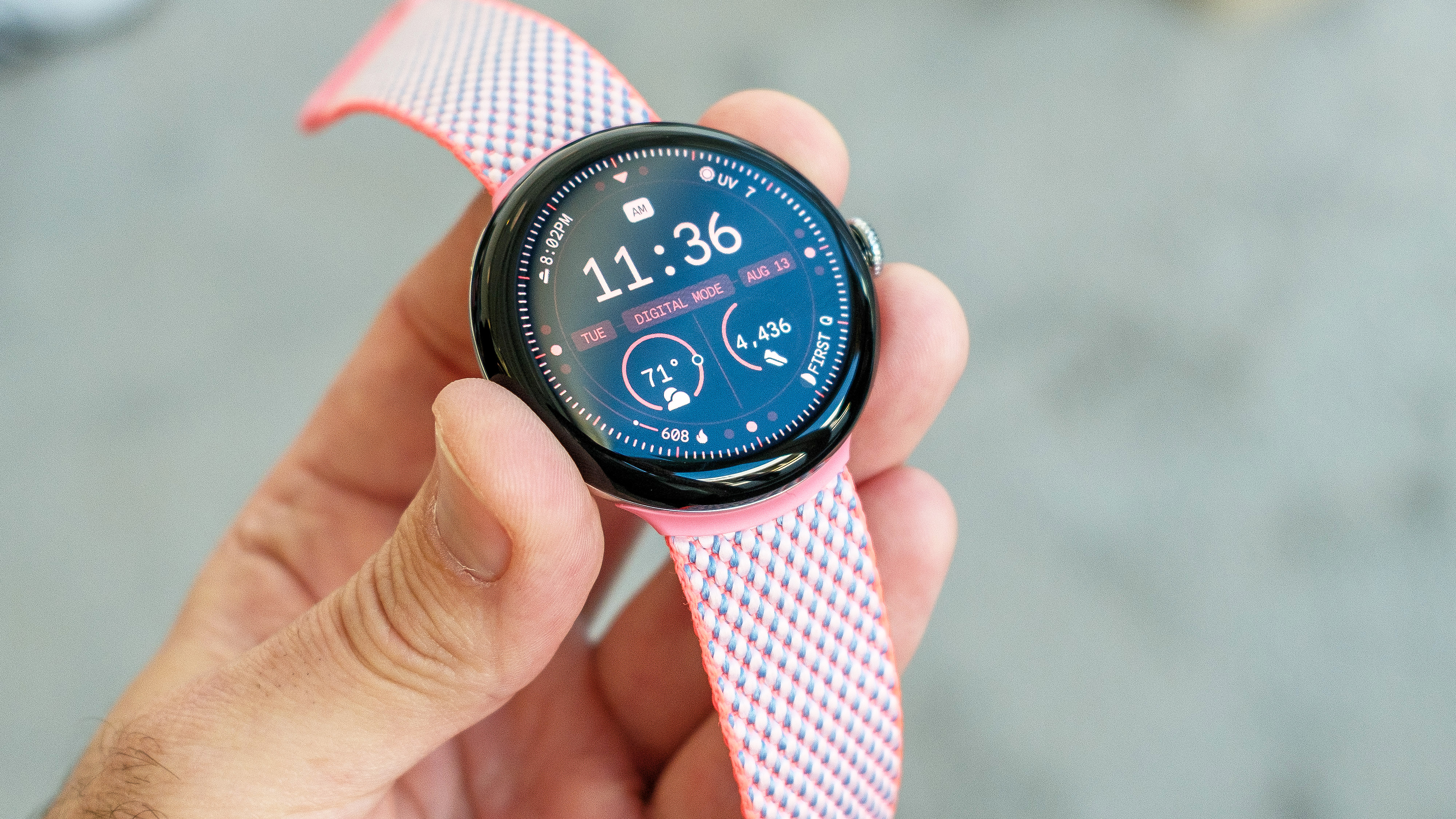 Google Pixel Watch 3 in a user's hand showing the screen