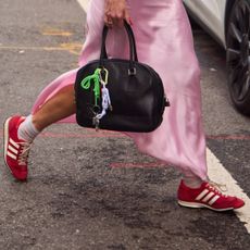 red sneakers on the street at new york fashion week