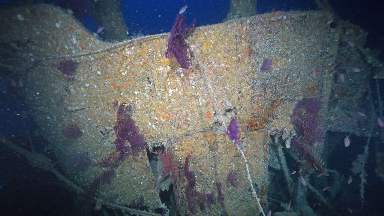 After more than 70 years under the water, only one side of the wrecked submarine's conning tower is still whole; but the embossed letters of its name can be discerned in high resolution photographs.