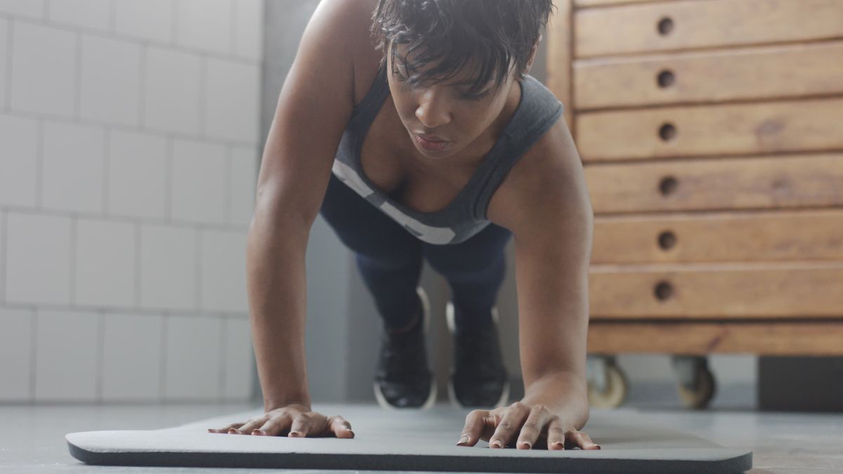 Woman halfway thought the walking plank movement