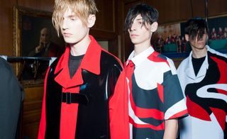 three male models wearing black white and red