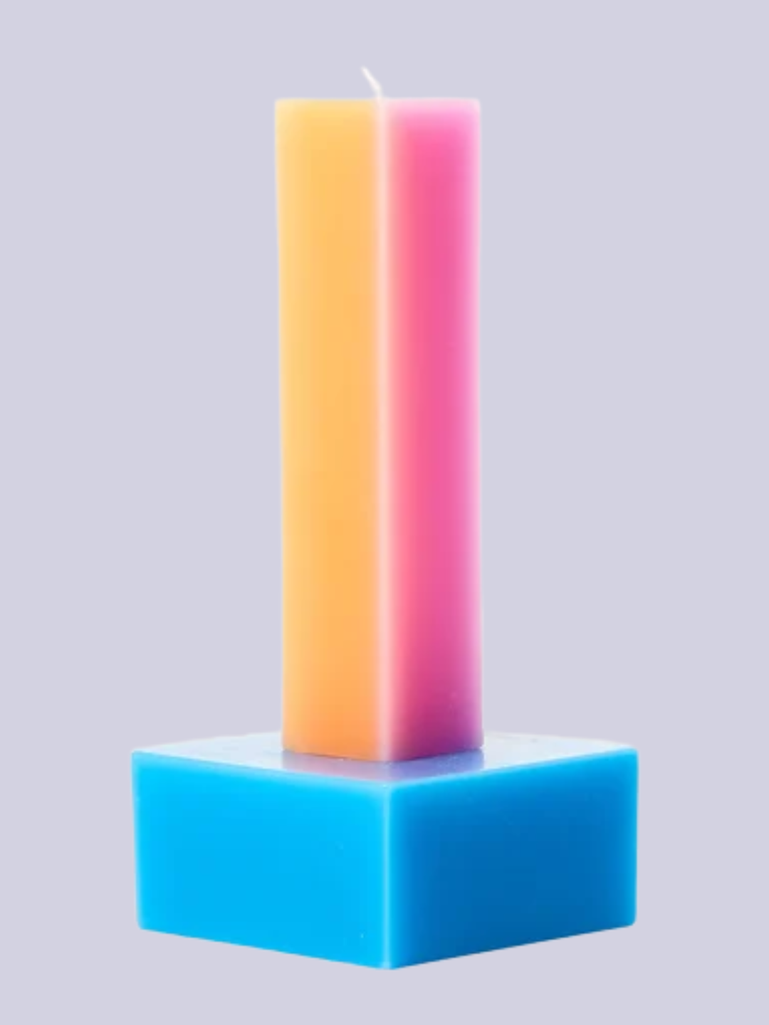A colorful pillar candle by Yinka Ilori