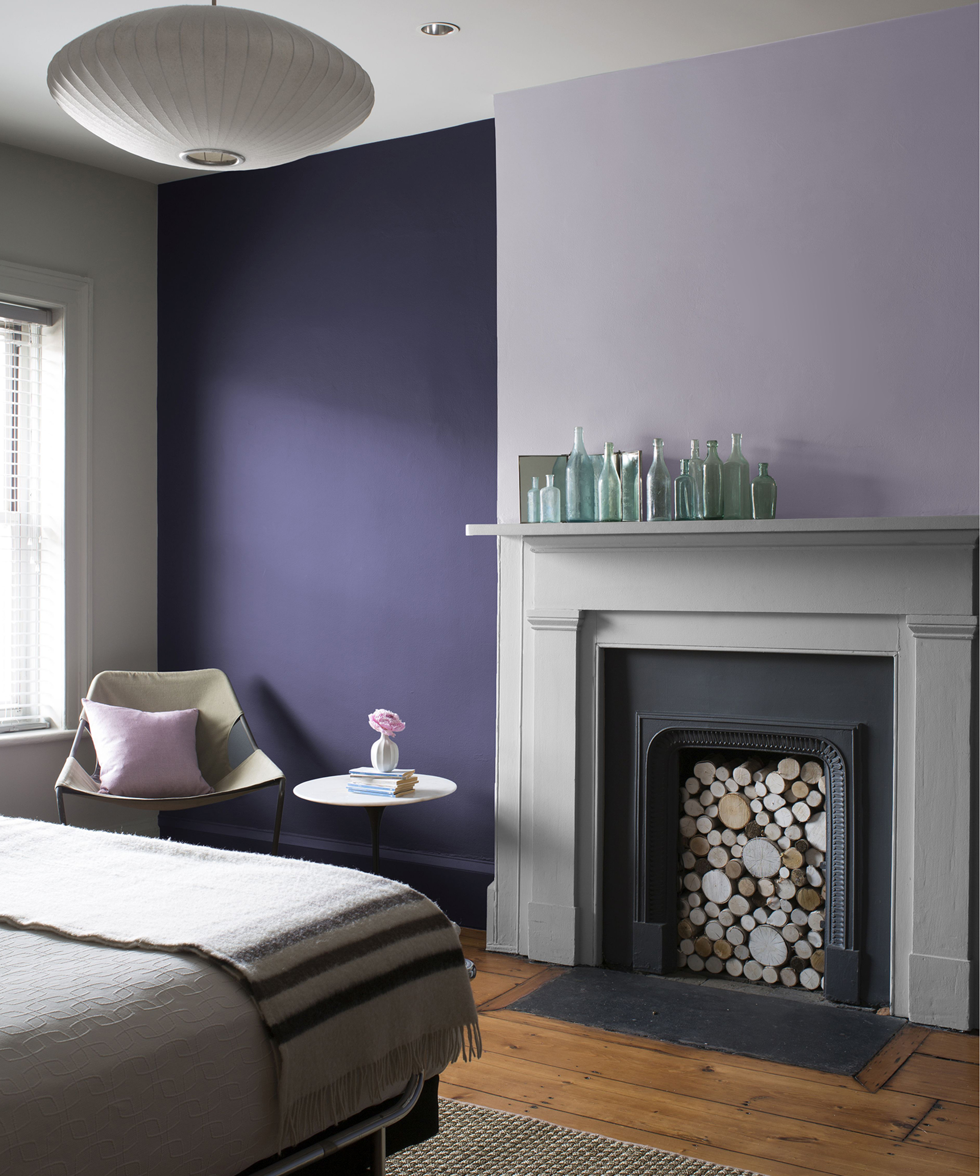 A dark purple and lilac bedroom by Benjamin Moore using Benjamin Moore Aura Matte Dark Lilac 2070- 30, Aura Matte Lavender Mist 2070-60