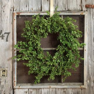 silk boxwood wreath on door