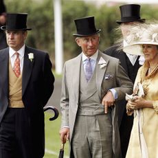 Prince Andrew, King Charles and Queen Camilla standing in a row at Royal Ascot