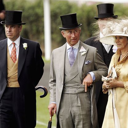 Prince Andrew, King Charles and Queen Camilla standing in a row at Royal Ascot