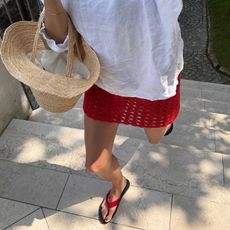 Lucy Williams wearing red flip-flops in Lake Como