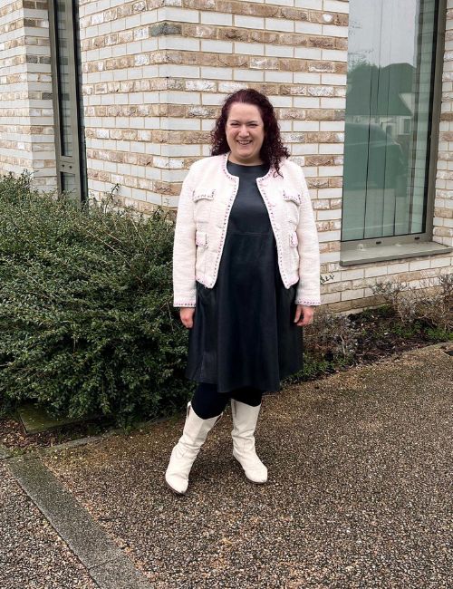 rivkie baum in a blazer and dress