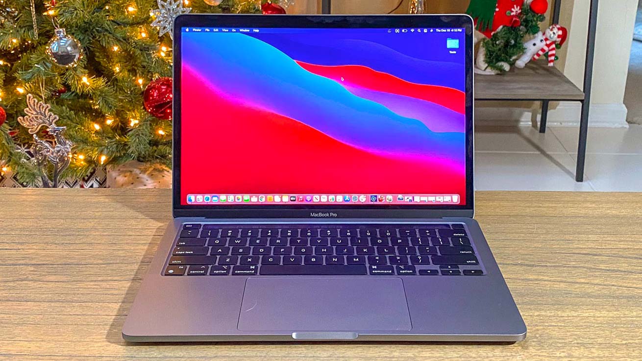 MacBook Pro with M1 in front of a Christmas tree