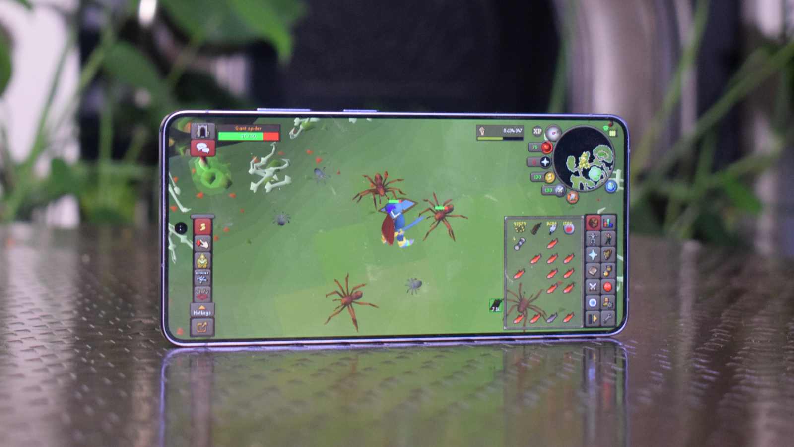 The Samsung Galaxy S26 Ultra on a table, playing Old SChool Runescape.