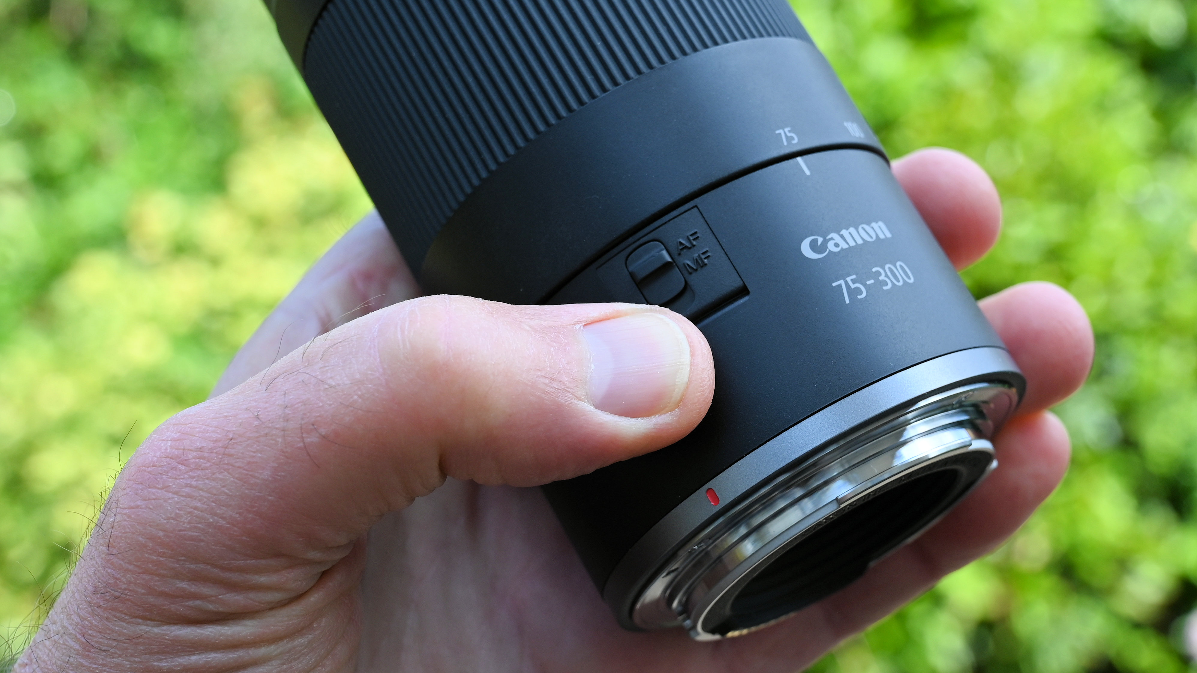 Canon RF 75-300mm f/4-5.6 product shot held in hand