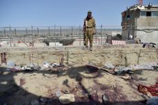 Taliban guard at Kabul airport bombing site