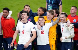 Kieran Trippier (centre) celebrates England's Euro 2020 semi-final victory over Denmark with his team-mates