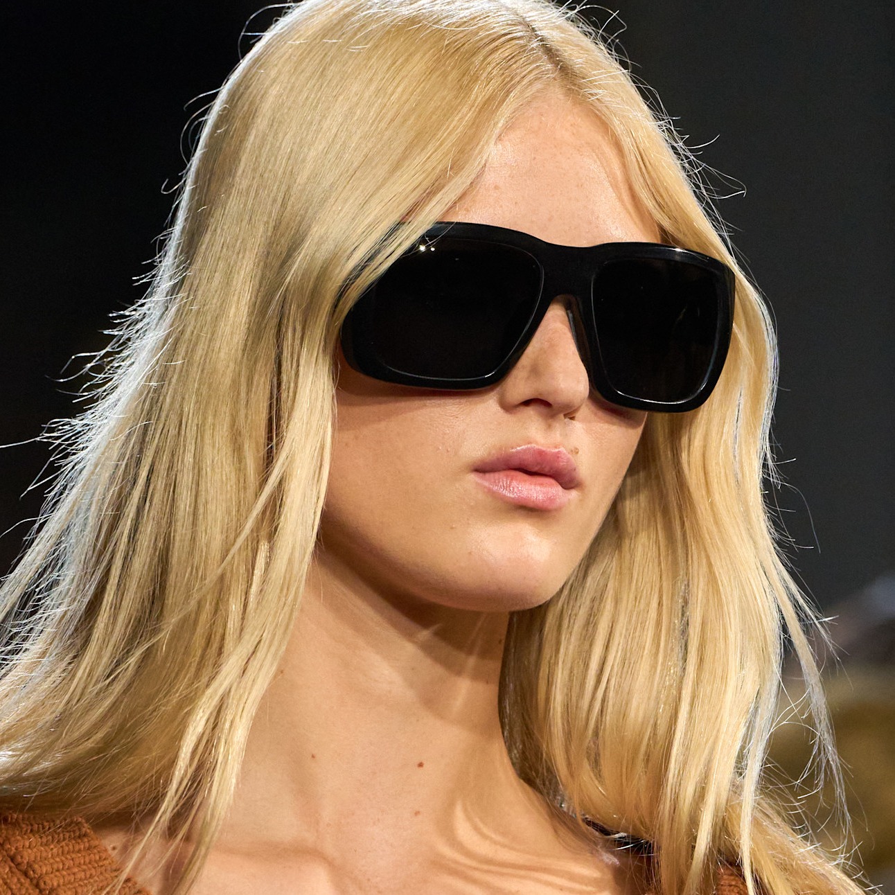 woman with blonde hair and sunglasses