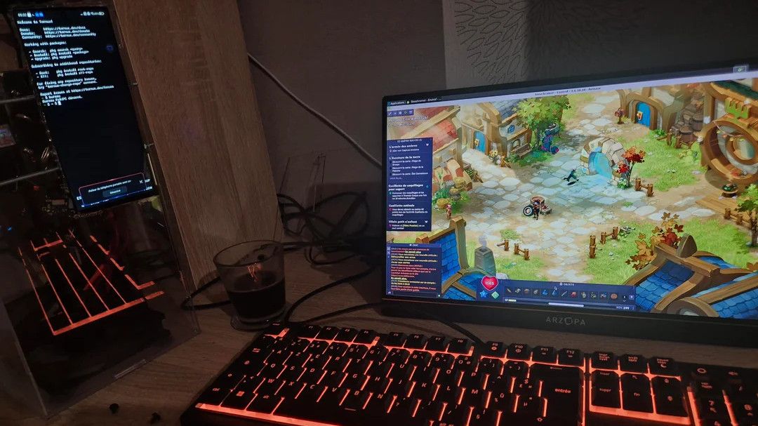 Android Phone in Desktop PC, placed on a desk next to a monitor and keyboard