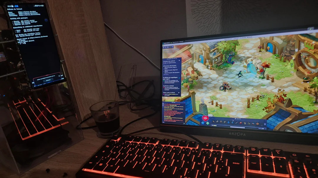 Android Phone in Desktop PC, placed on a desk next to a monitor and keyboard