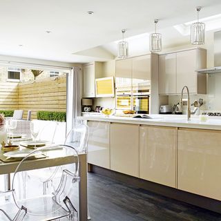 contemporary kitchen with dining area and chairs