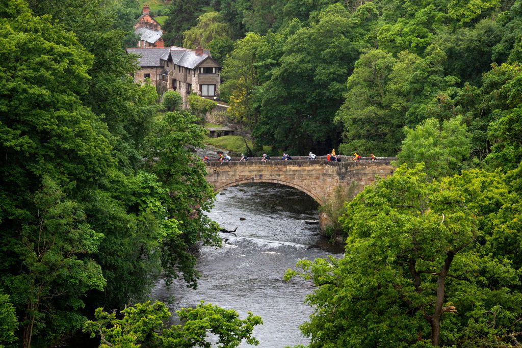WELSHPOOL WALES JUNE 09 A general view of the peloton passing a bridge during the 8th The Womens Tour 2022 Stage 4 a 1447km from Wrexham to Welshpool on June 09 2022 in Welshpool Wales Photo by Justin SetterfieldGetty Images