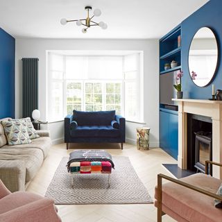 sitting room with teal blue walls and fireplace