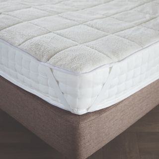 mattress topper on top of mattress