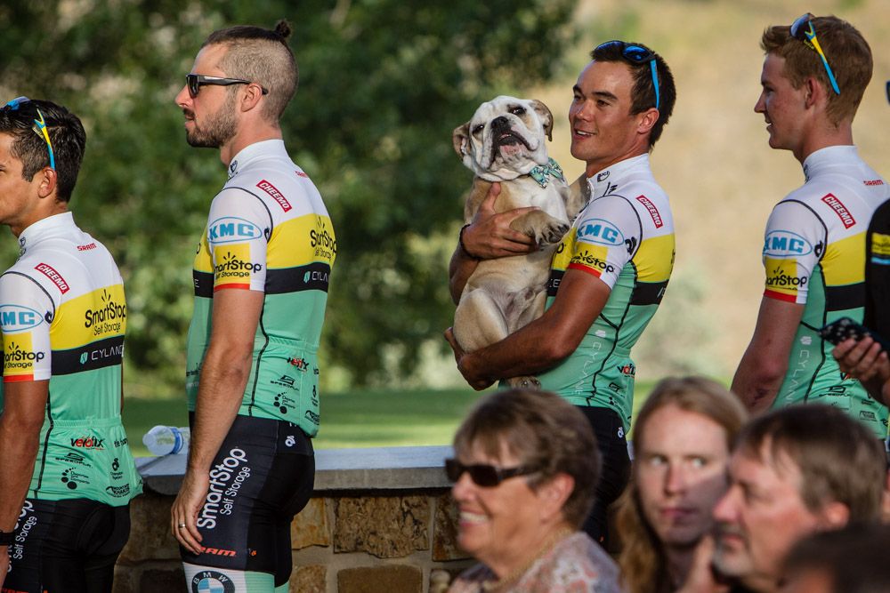 SmartStop walks to the stage with the team mascot.