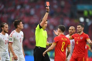 Wales winger Harry Wilson is shown a red card against Denmark at Euro 2020.