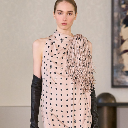 Photo of runway model wearing printed maxi dress from Altuzarra Fall Winter 2026 collection.