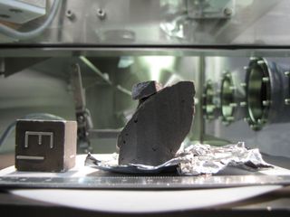 This image shows an Apollo moon rock sample (catalogued as 10020,234) in the Lunar Sample Laboratory at the Johnson Space Center, Houston.