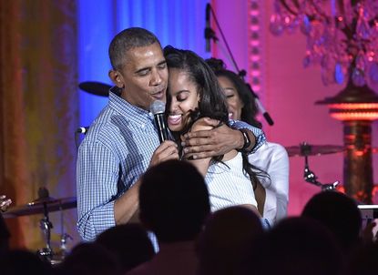 President Obama hugs daughter Malia Obama on her 18th birthday.