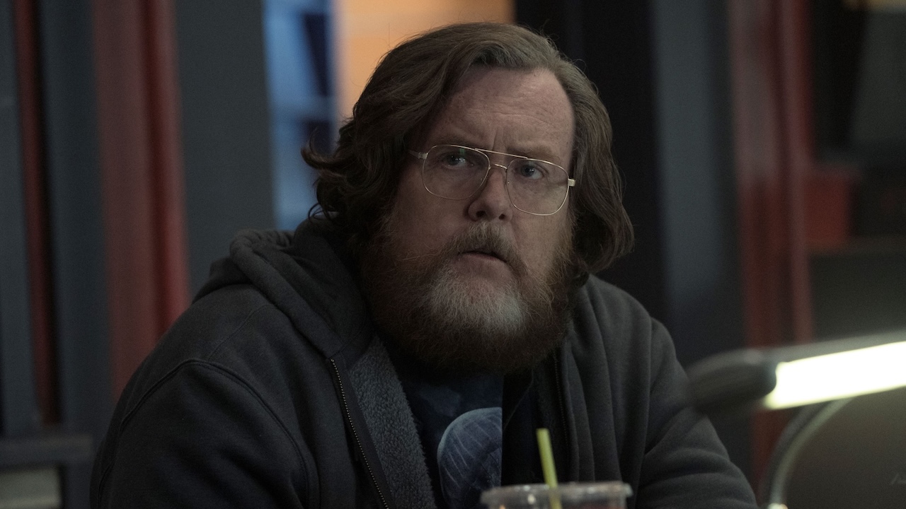 Steve Agee as John Economos in Peacemaker Season 1
