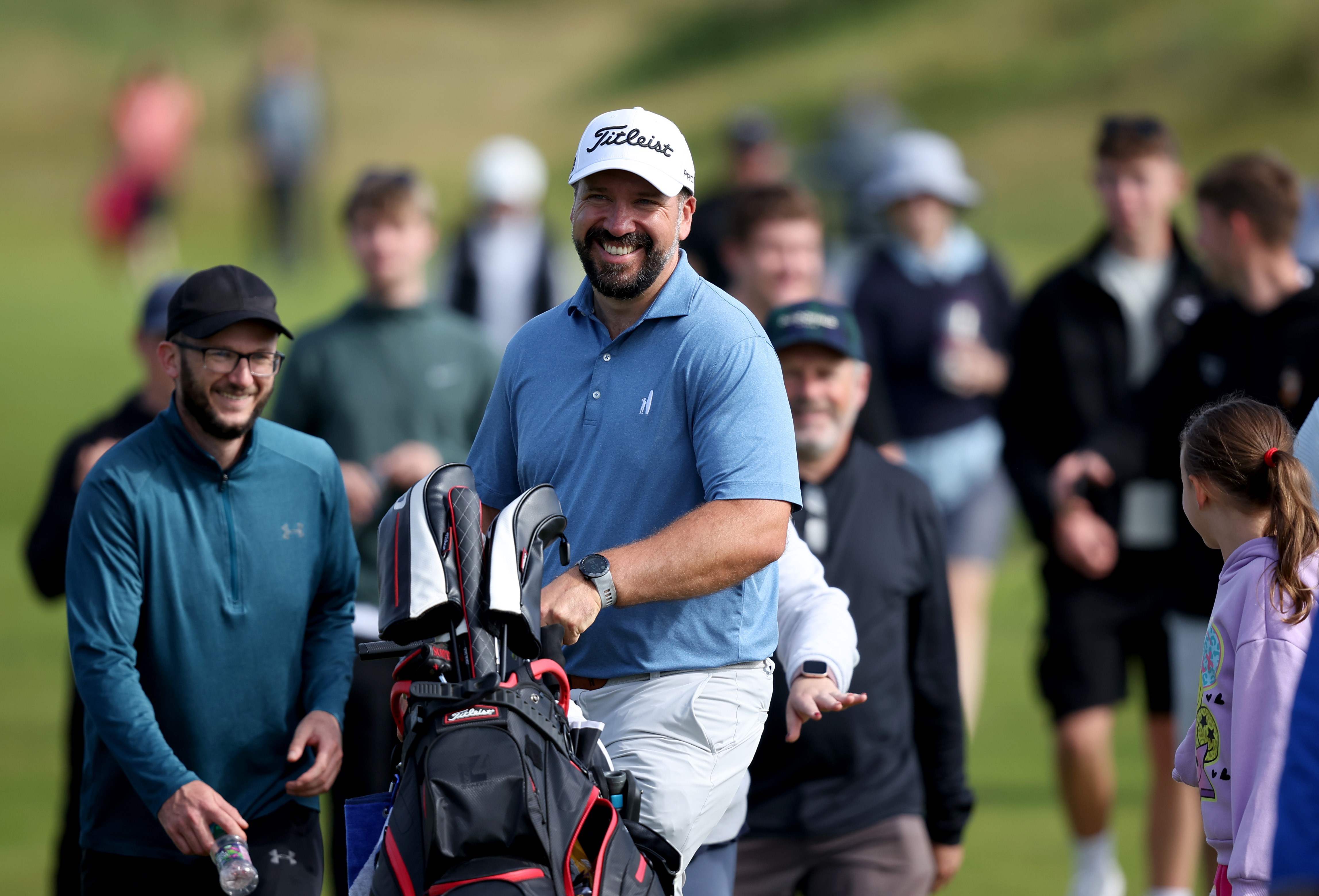Peter Finch smiling and pushing his trolley during Open Final Qualifying