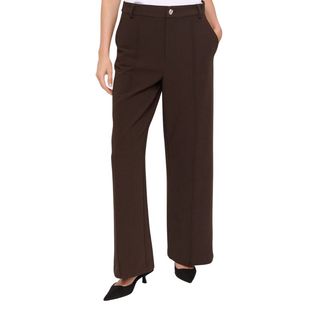 Flat lay image of woman wearing brown trousers