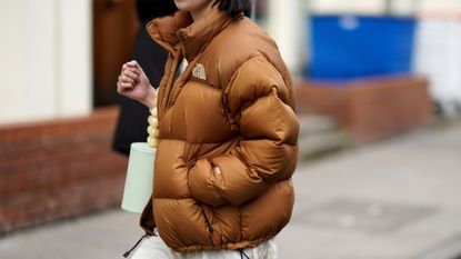 street style influencer wearing one of the Best North Face jacket