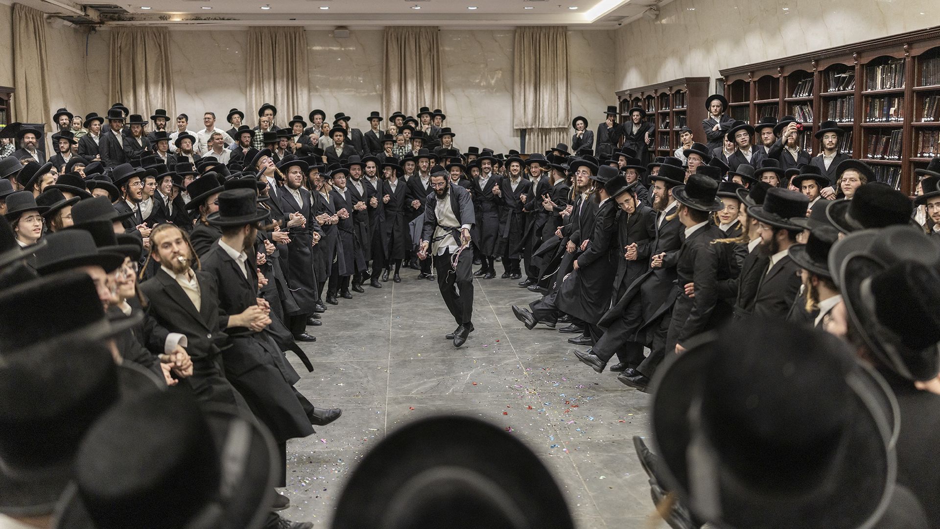
                                Ultra-Orthodox Jewish men dance as they celebrate the release of a yeshiva student detained for refusing military service in Elad, Israel
                            