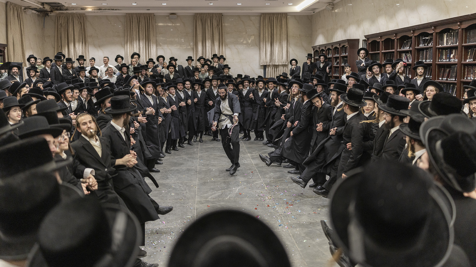 Ultra-Orthodox Jewish men dance as they celebrate the release of a yeshiva student detained for refusing military service in Elad, Israel