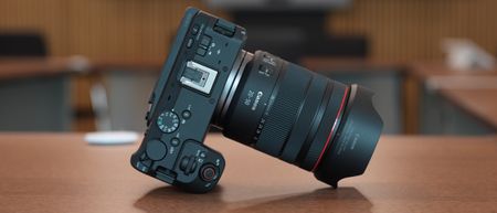 Canon EOS R6 V with the Canon RF 20-50mm f/4L IS USM PZ on a wooden surface