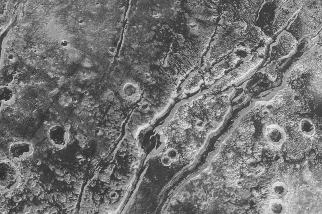 Photo of Pluto's surface with faults