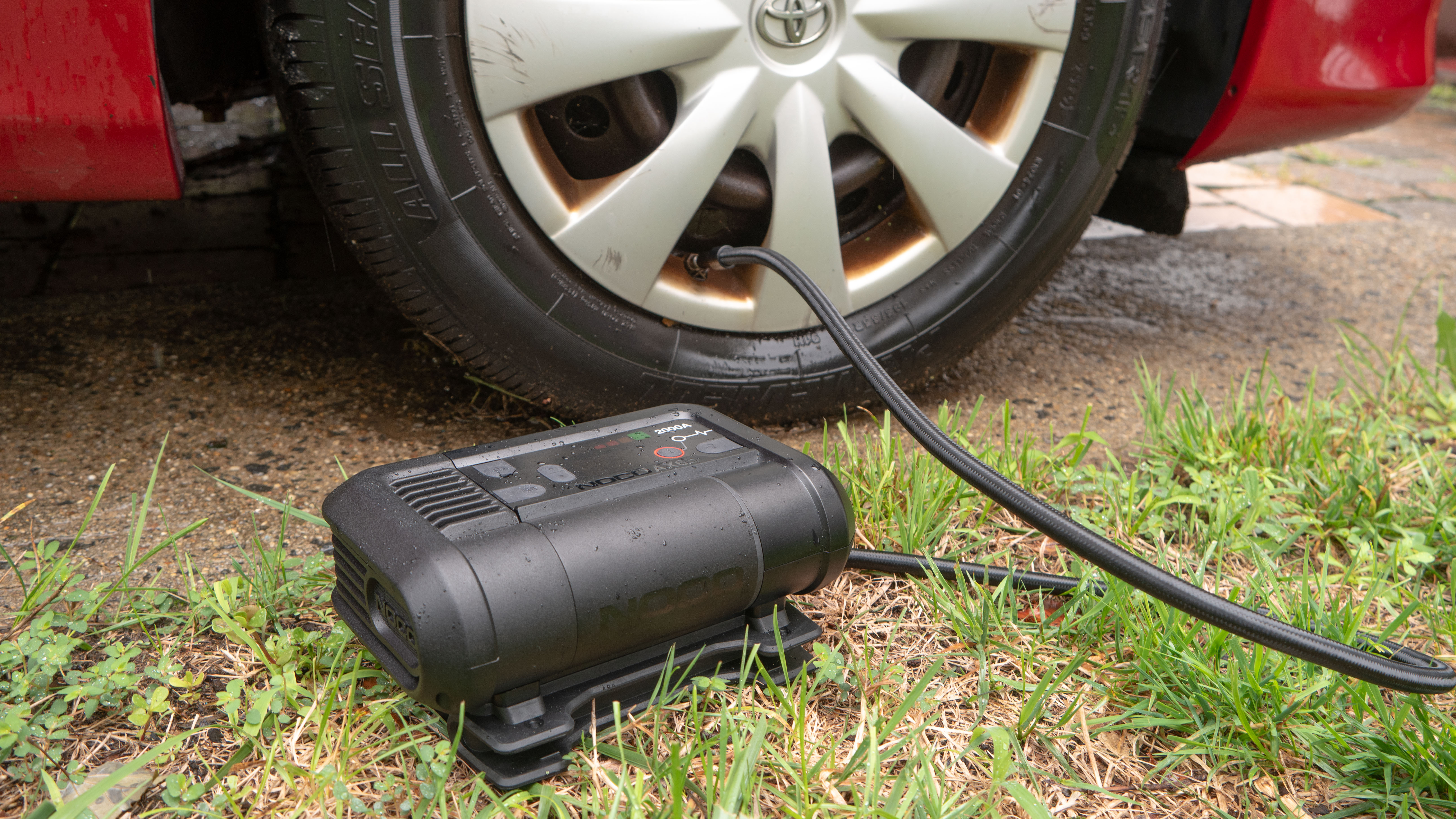 NOCO Boost Air AX65 inflating tire.